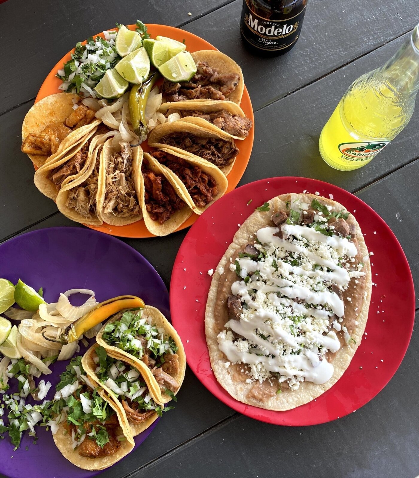 Colorful spread of tacos and huarache from Los Taco H's